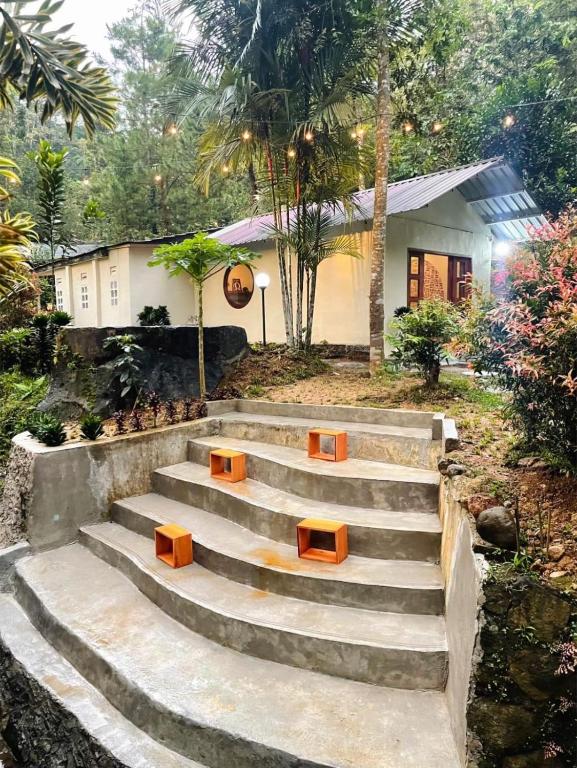 a set of stairs in front of a house at Villa Arkhazio in Megamendung