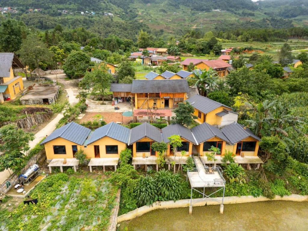 an aerial view of a house in a village at Mun Homestay in Ha Giang