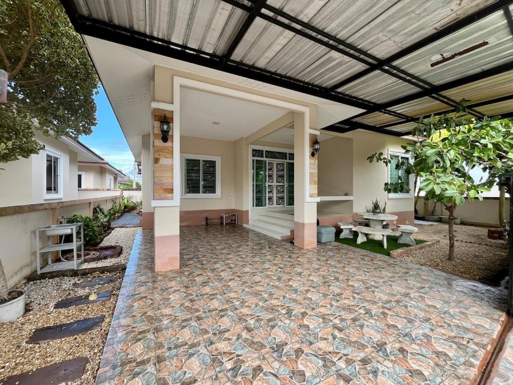 an outdoor patio of a home with a ceiling at BP Private Home in Ban Nong Sa