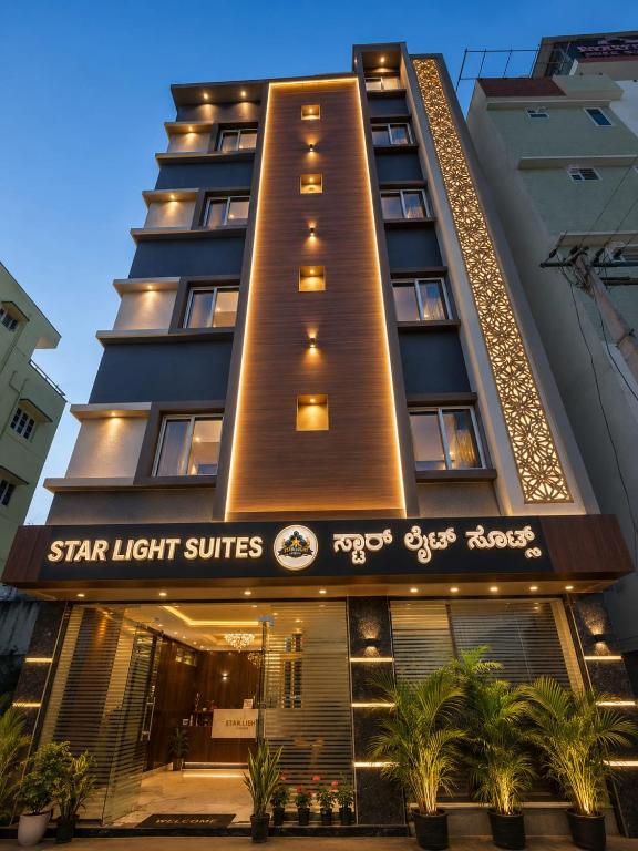 a tall building with a star light suites sign on it at Star Light Suites in Bangalore