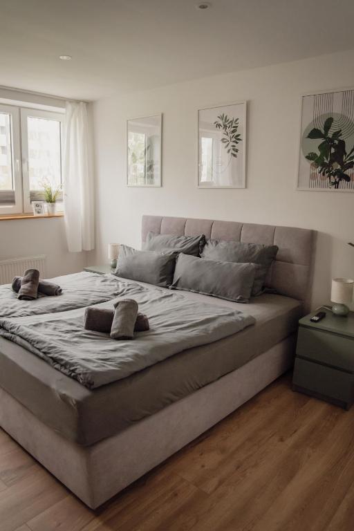 a large bed in a bedroom with white walls at Apartment Claussen 1 in Bremerhaven