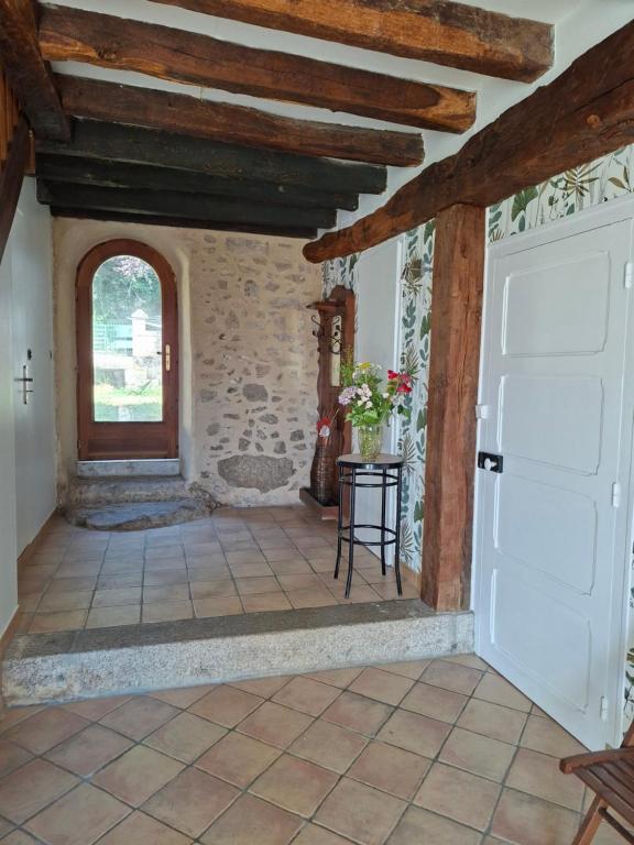 a hallway of a house with a white door at Domaine de la Bréssandière in Châtillon-sur-Thouet