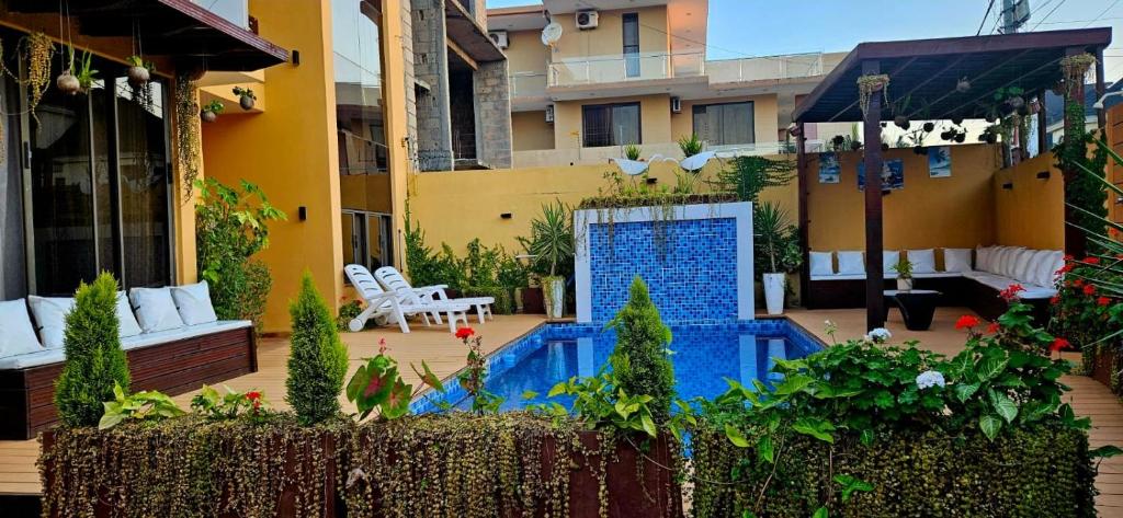 a courtyard with a swimming pool in a building at Premium Residence in Maputo