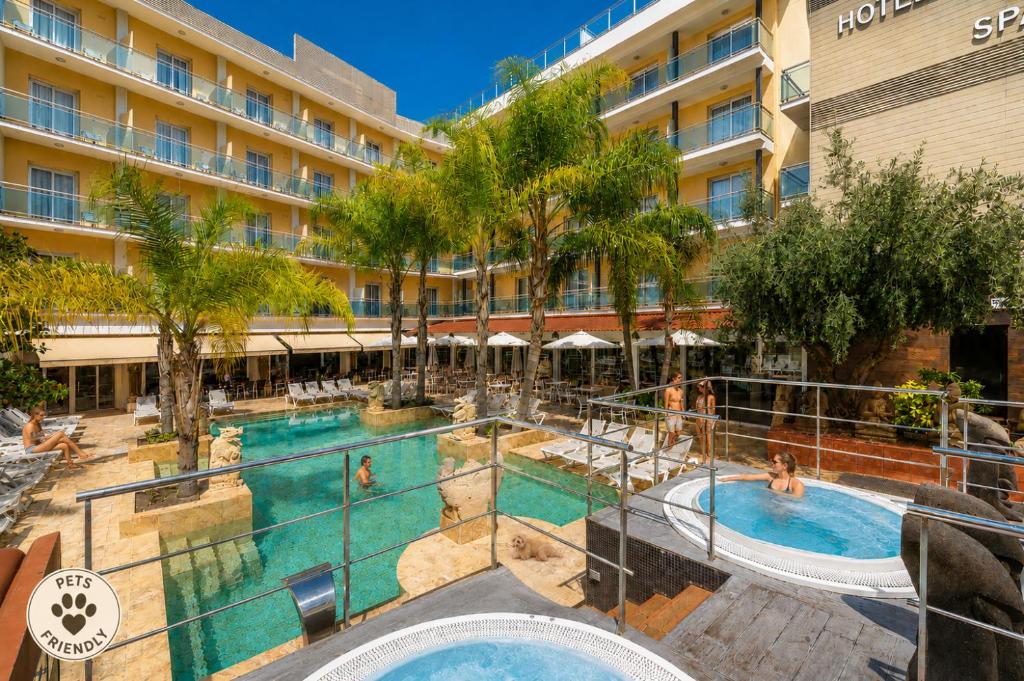 an image of a swimming pool at a hotel at Hotel la Palmera & Spa in Lloret de Mar