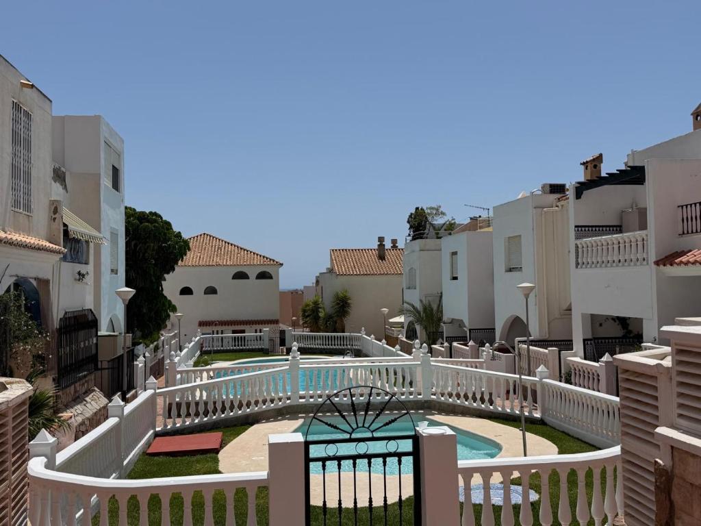 a view from the balcony of a villa with a swimming pool at Casa Atalaya Playa R&R in Aguadulce