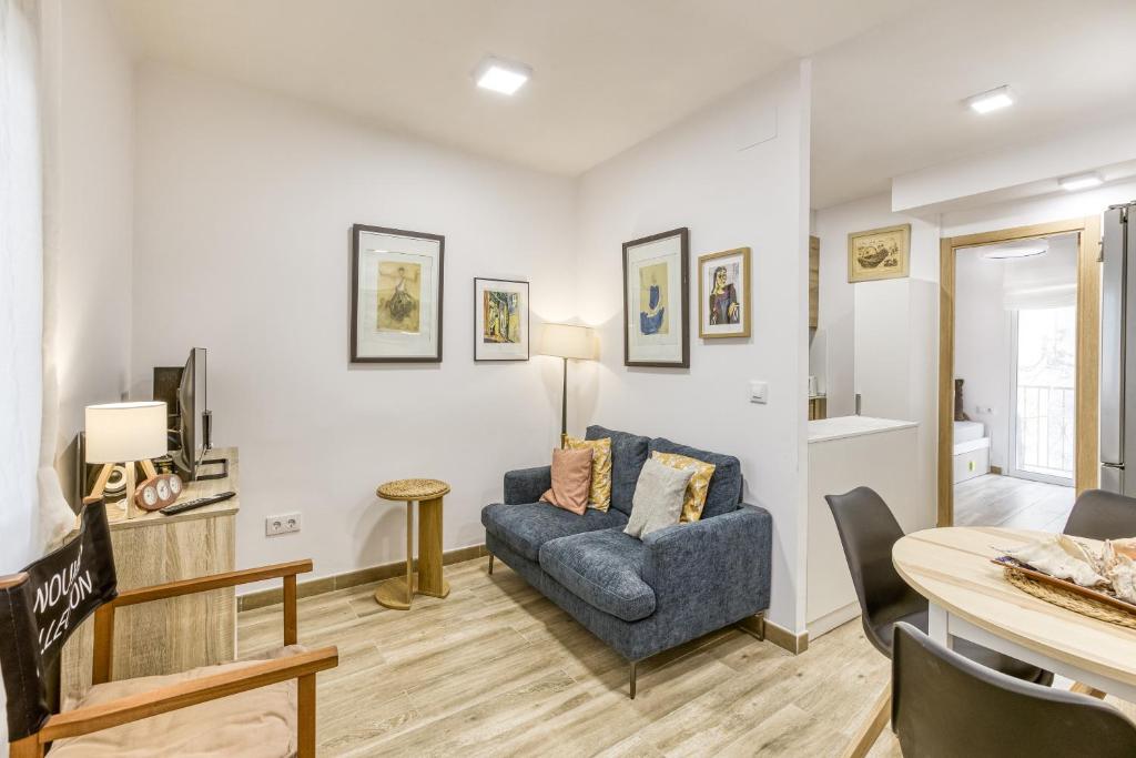 a living room with a couch and a table at La Pau de Portbou 2 in Portbou