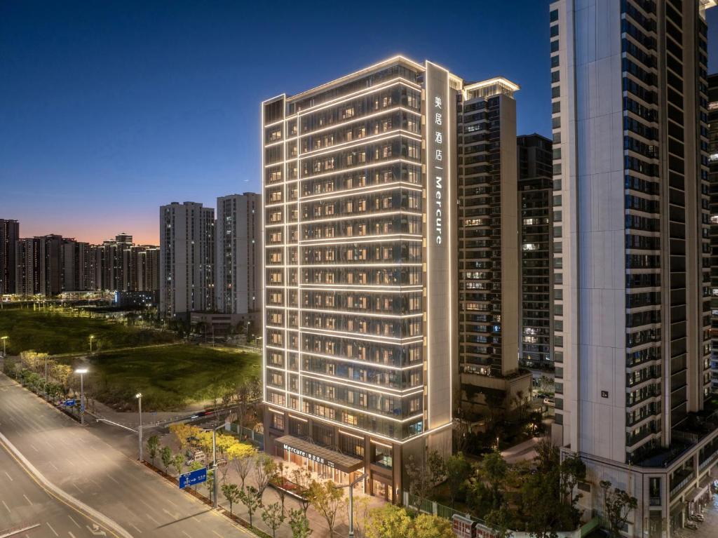 an overhead view of a tall building in a city at Mercure Kunming Wujiaba in Kunming