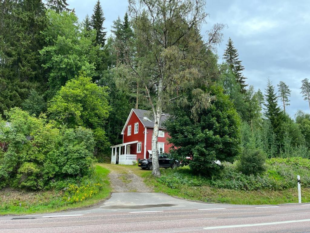 a red house on the side of a road at Amnerud 5 in Amnerud