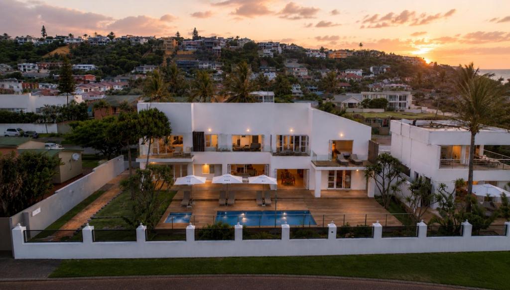 an aerial view of a house with a sunset at Vetho House Villa Ballito in Ballito