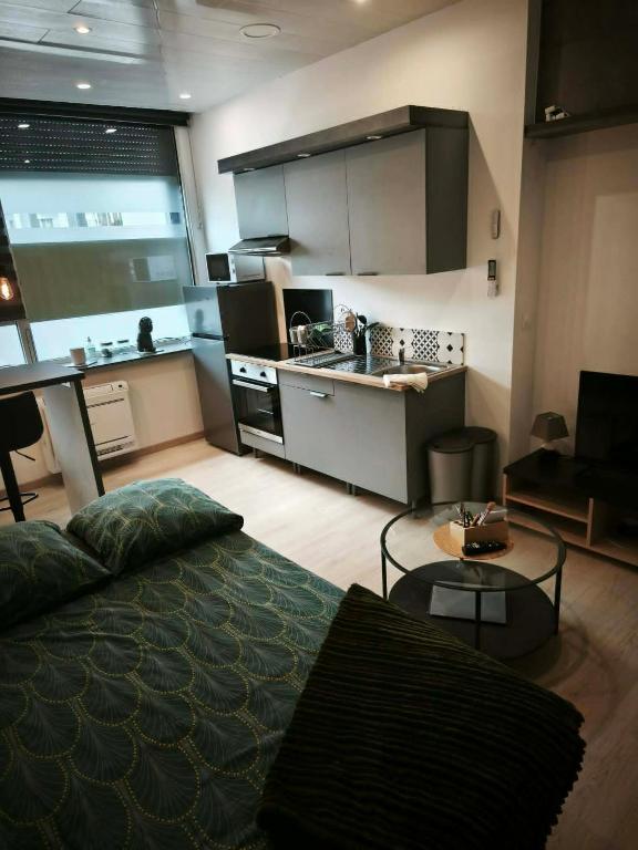 a kitchen with a large bed in a room at Betting 2 in Merlebach