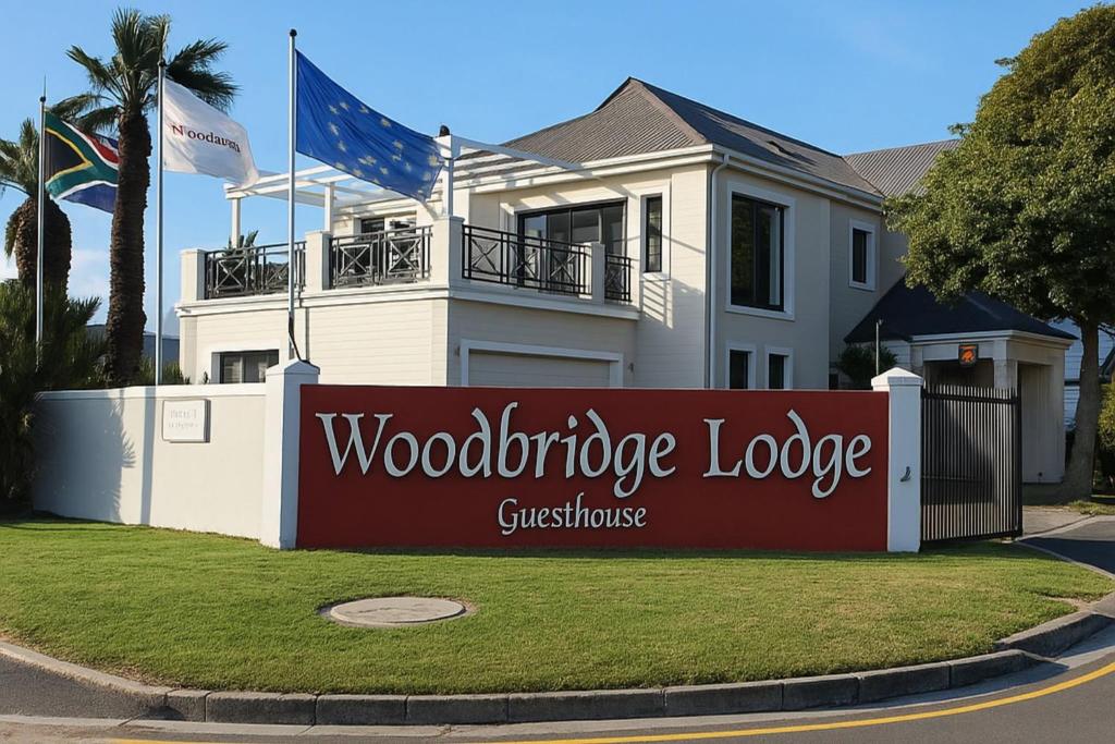 a house with a sign in front of it at Woodbridge Lodge in Cape Town
