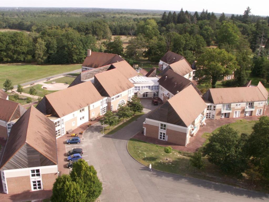 an aerial view of a village with houses at Domaine de Mont-Evray in Nouan-le-Fuzelier