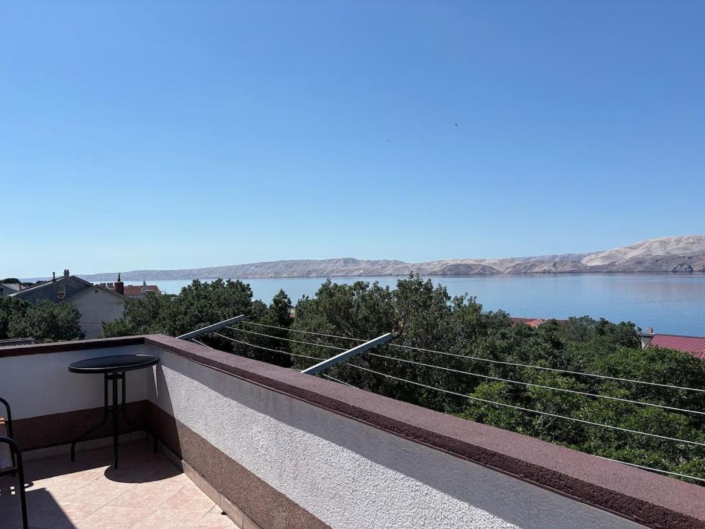 a balcony with a view of the water at Apartment Ivan in Karlobag