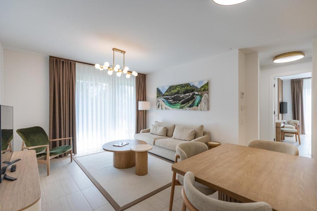 a living room with a couch and a table at Appartement Rosalia Delta Resort 741 in Ascona