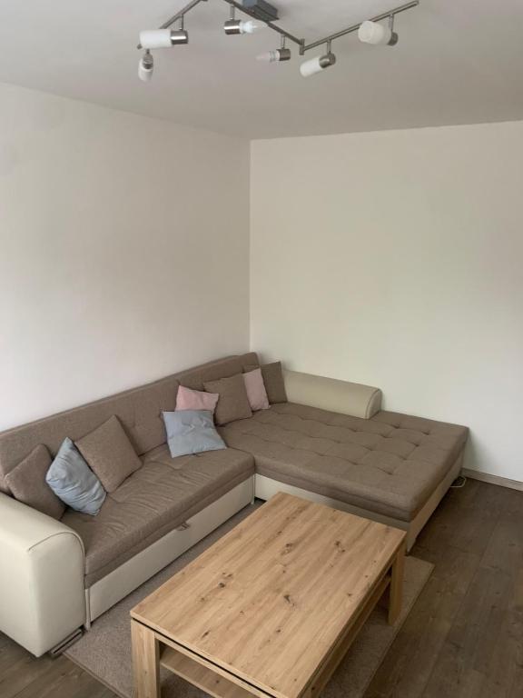 a living room with a couch and a coffee table at Your Home 27 with parking in Myslava
