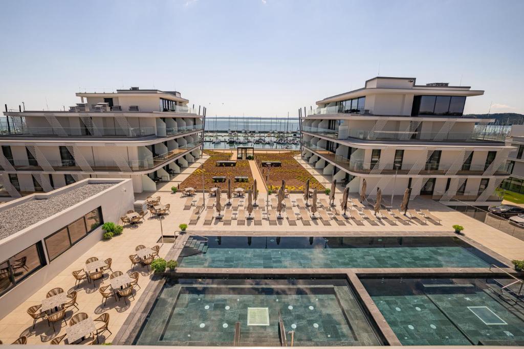 an aerial view of a building with a swimming pool at BIRGÉS HOTEL Lifestyle and View in Balatonfüred