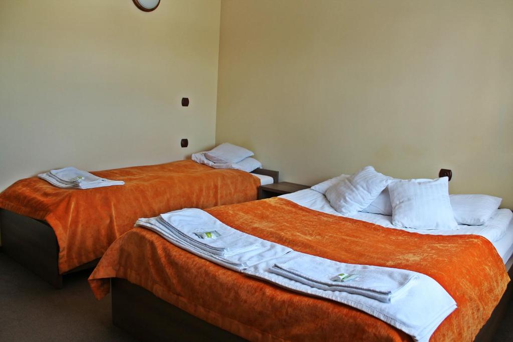 Postel nebo postele na pokoji v ubytování Pod Strzechą