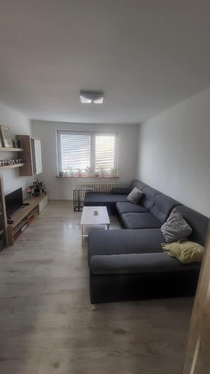 a living room with a couch and a table at 3 room apartment in Trnava