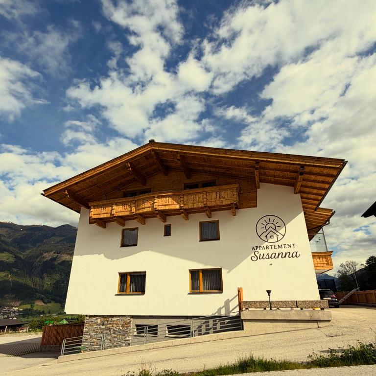 a building with a wooden roof on top of it at Appartement Susanna in Fügen