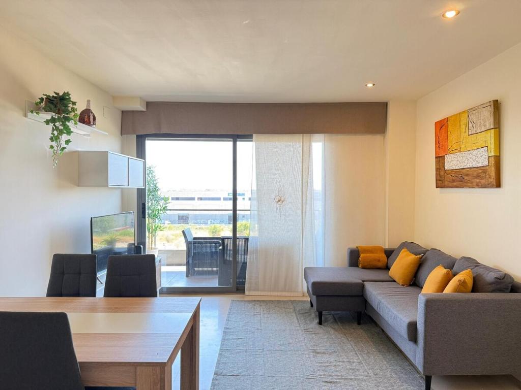 a living room with a couch and a table at Apartment in Castelldefels! in Castelldefels
