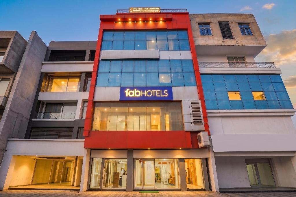a building with a sign on the side of it at FabHotel Samarth Residency By the Arrow in New Delhi