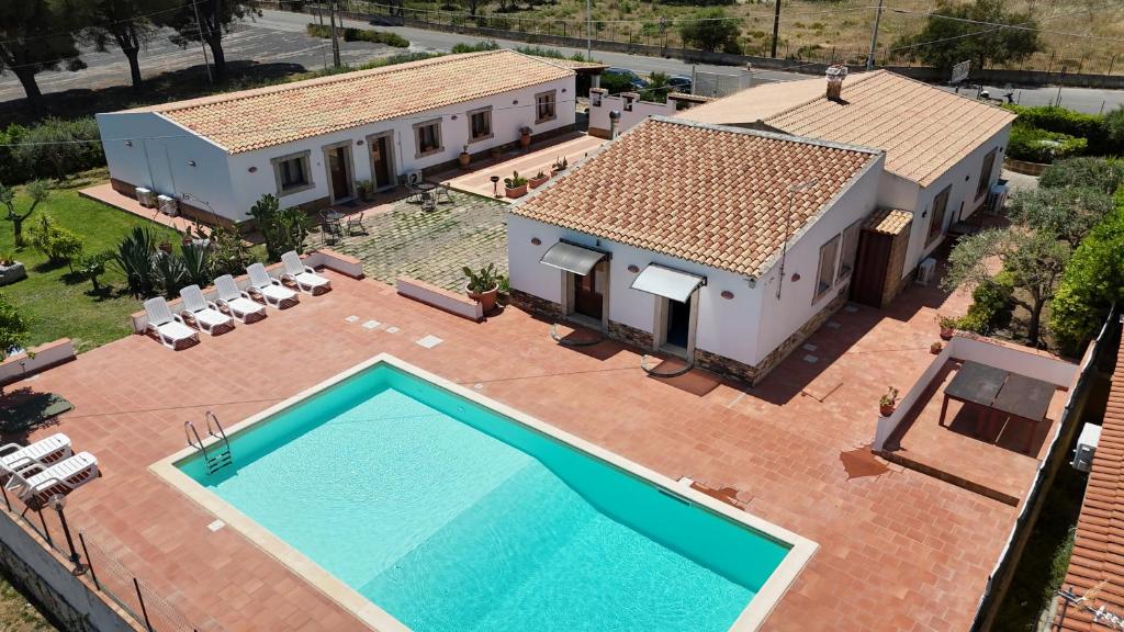 an aerial view of a house with a swimming pool at Cavagrande Guest House in Avola