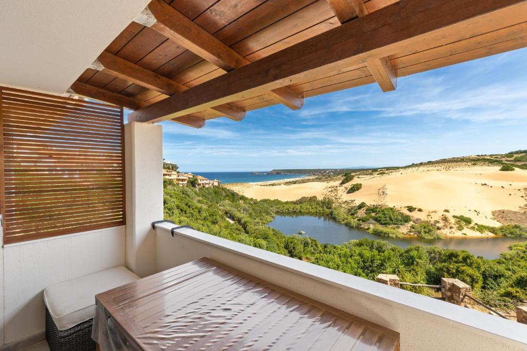 a balcony with a view of a lake at Sabbiamare Torre dei Corsari in Torre Dei Corsari