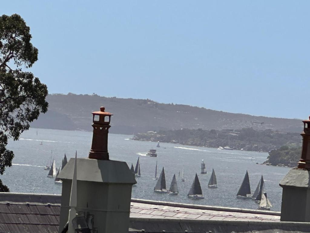 a view of a body of water with boats at Darling Point with Harbour Views in Sydney