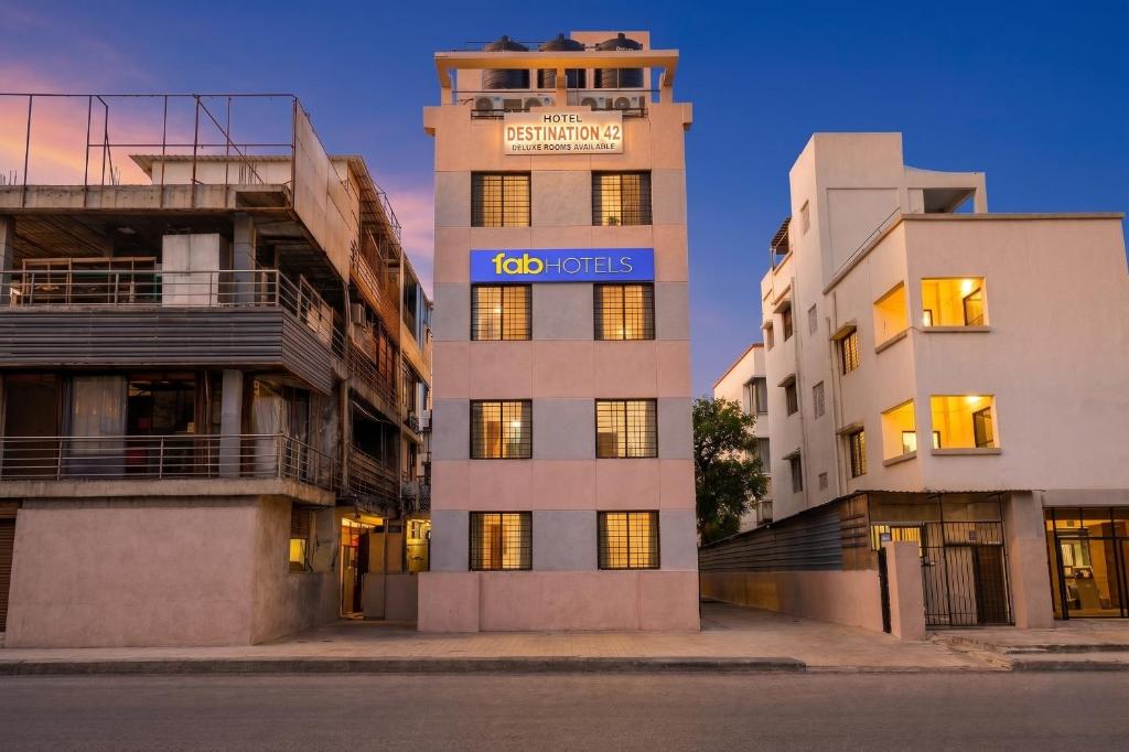 a tall building with a too variables sign on it at FabHotel Destination 42 - Nr Pheonix Mall in Kharadi