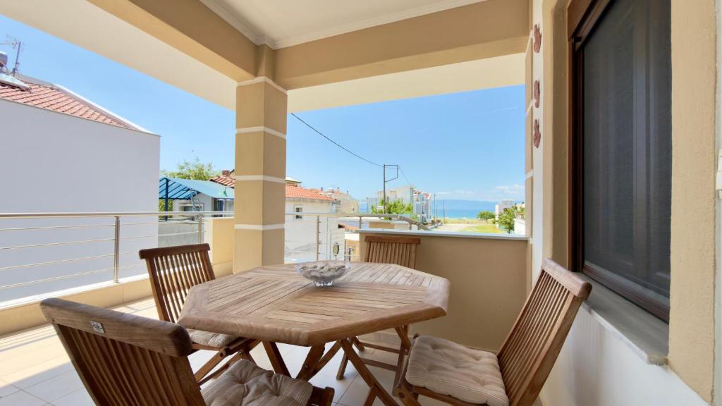 a table and chairs on a balcony with a view at Casa De Sol by Horizon Homes in Ofrínion