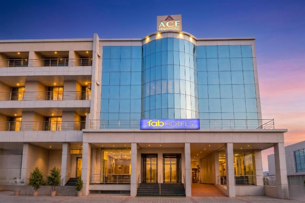 an office building with a sign on it at FabHotel Ace Prime in Greater Noida