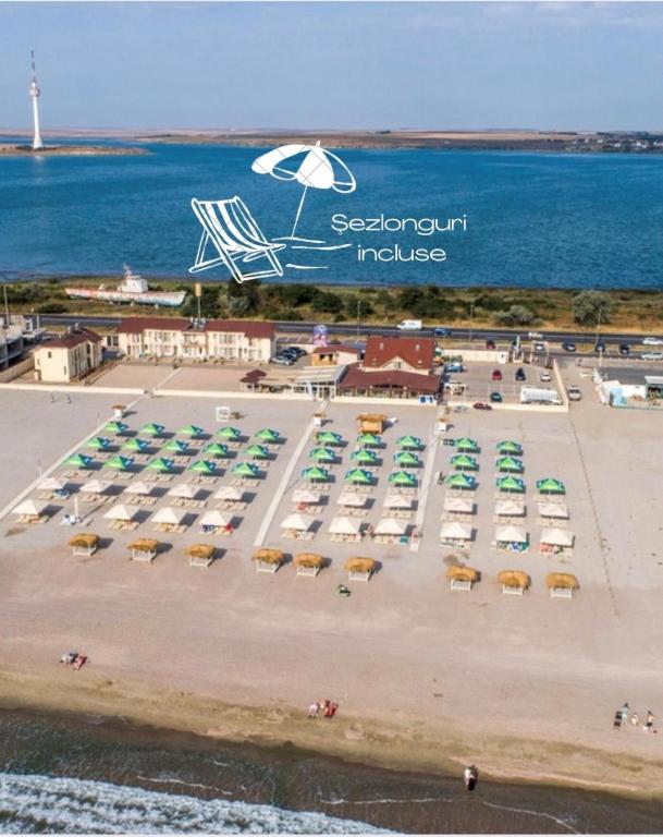 an aerial view of a parking lot with a bunch of cars at Vila Plaja Azur in Eforie Nord