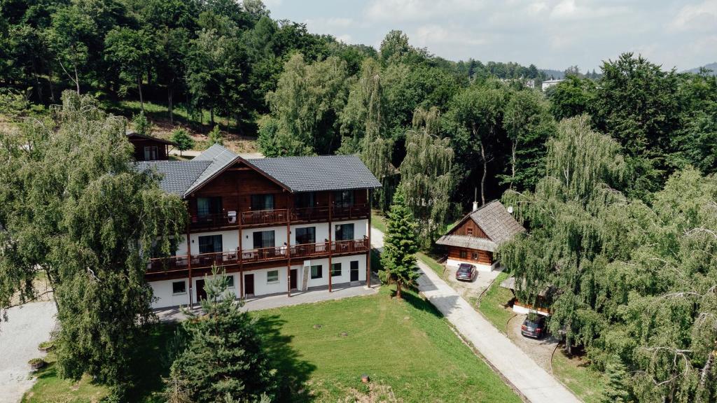 an aerial view of a house in a forest at Wellness penzión Predná Hora in Muráň