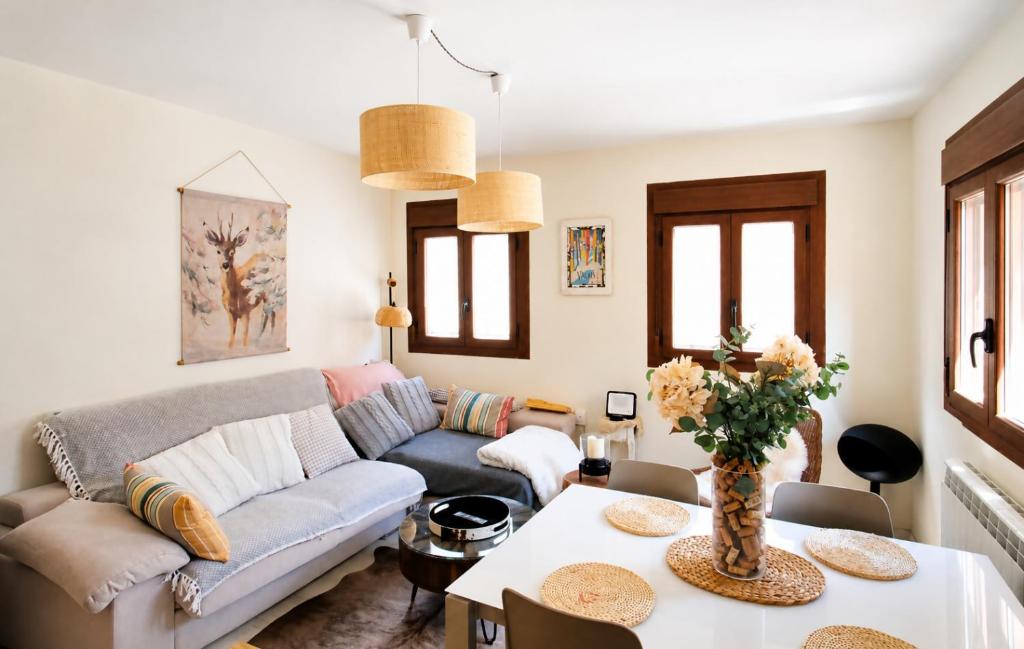 a living room with a couch and a table at Casa Santiago in Panticosa
