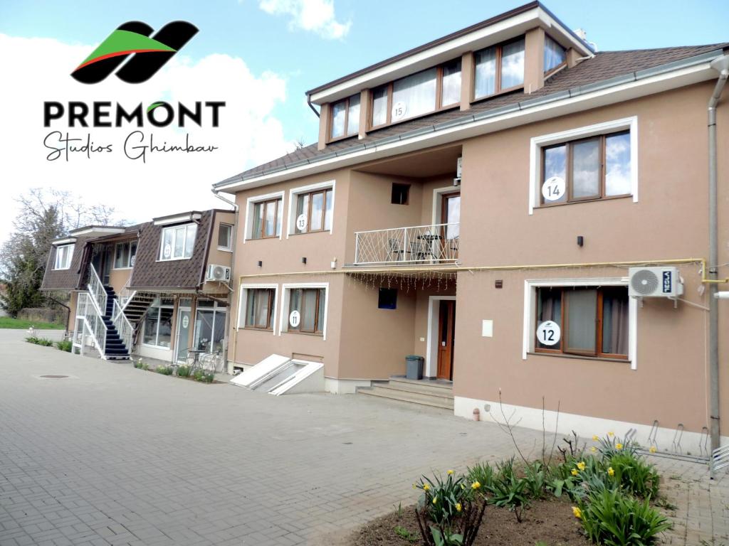a house with a driveway in front of it at Premont Studios Ghimbav in Ghimbav