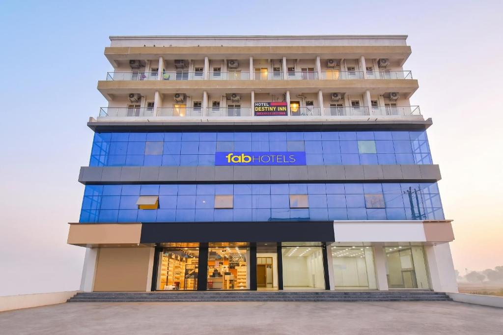 a building with theida hotels sign on it at FabHotel Destiny Living in Pune