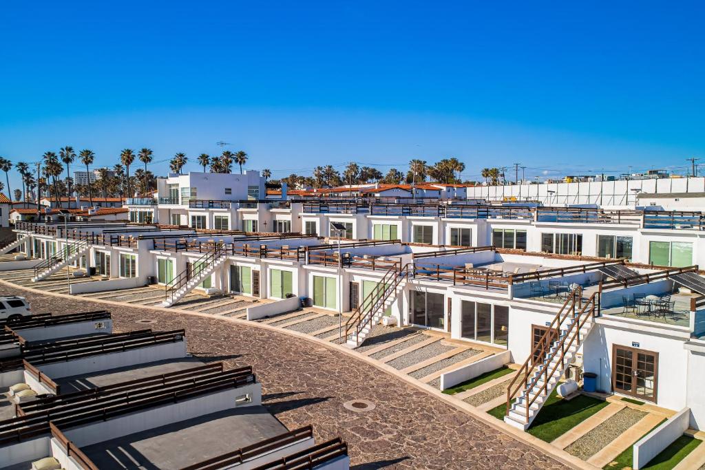 arial view of a building with stairs in front of it at Dog-friendly Home with Partial Ocean View, Heated Pool, Rooftop Terrace in Rosarito