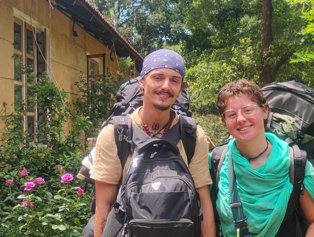 a man and a woman posing for a picture at River View Guest Rooms in Vythiri