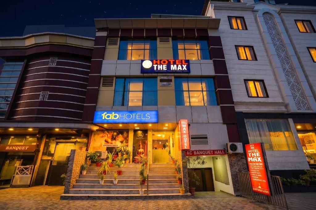 a building with a hotel the man sign on it at FabHotel The Max in Lucknow