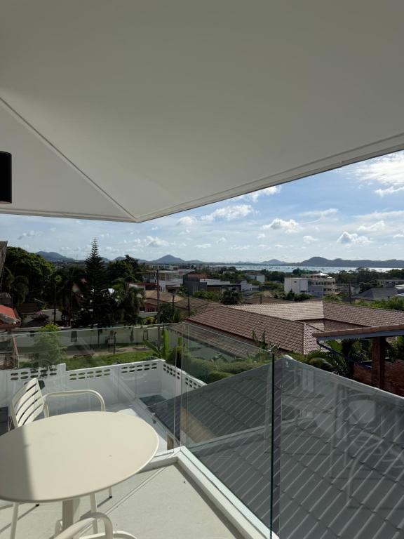 a view from the balcony of a house at Villa Tara - Sea view 5Br Rawai in Ban Saiyuan (1)
