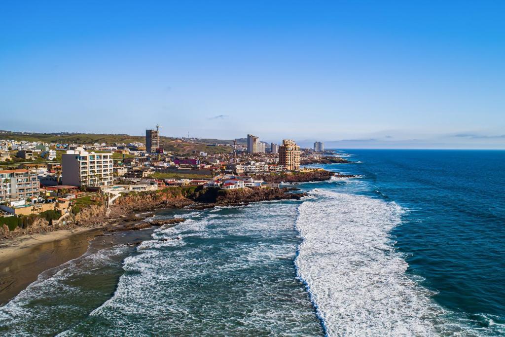 an aerial view of the ocean and a beach at Dog-Friendly Home with Heated Pool, Hot Tub, Partial Ocean Views & Balcony in Rosarito