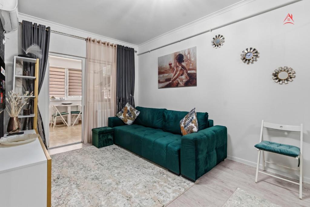 a green couch in a white living room at Nest45 in Roşu