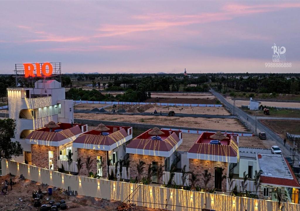 an aerial view of a building with red roof at RIO POOL VILLAS in Chīrāla