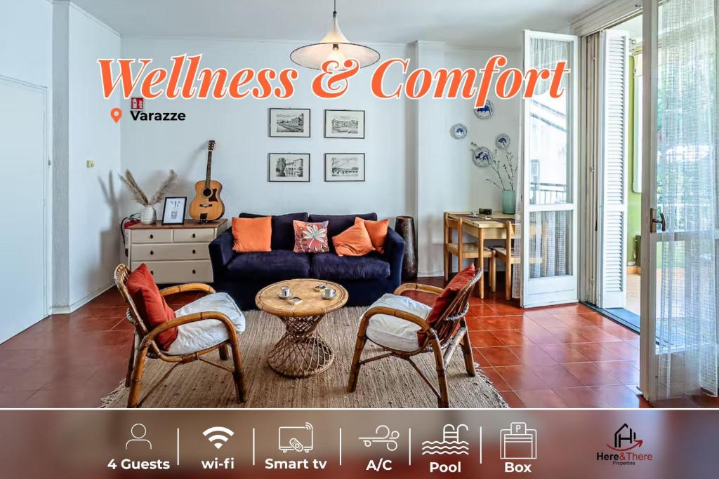 a living room with a blue couch and a table at Soft Comfort - Free Garage - Aria Condizionata - Smart TV in Varazze