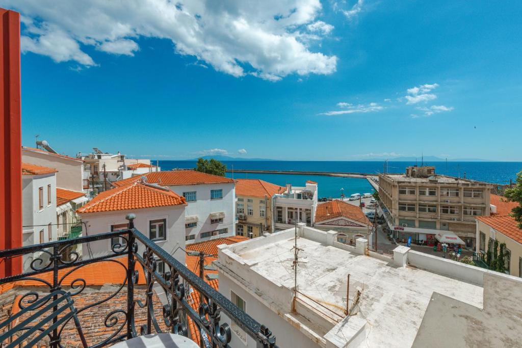 a view of the city from a balcony at Leda Hamam House in Plomari