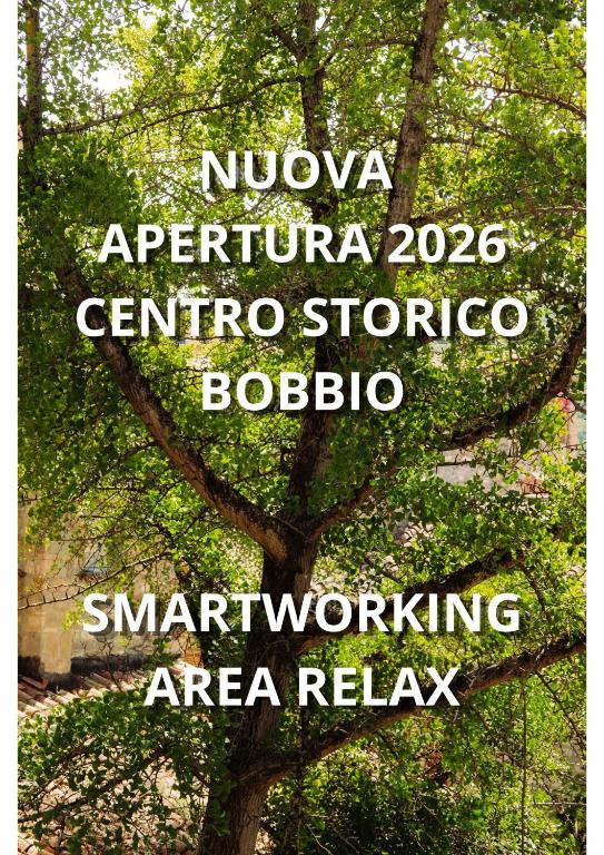 a tree with a sign that reads nvolvo april centuriato at La casa del Ginkgo in Bobbio