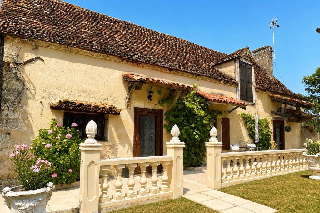 a house with a white fence in front of it at Chateau De La Ricardie, Gite La Ricardie, Beautiful Rural Property Gite Villa in Liorac