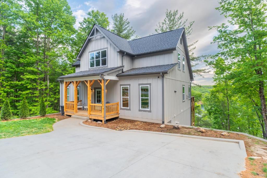 a house with a garage in the woods at The Overlook at Lake James in Nebo