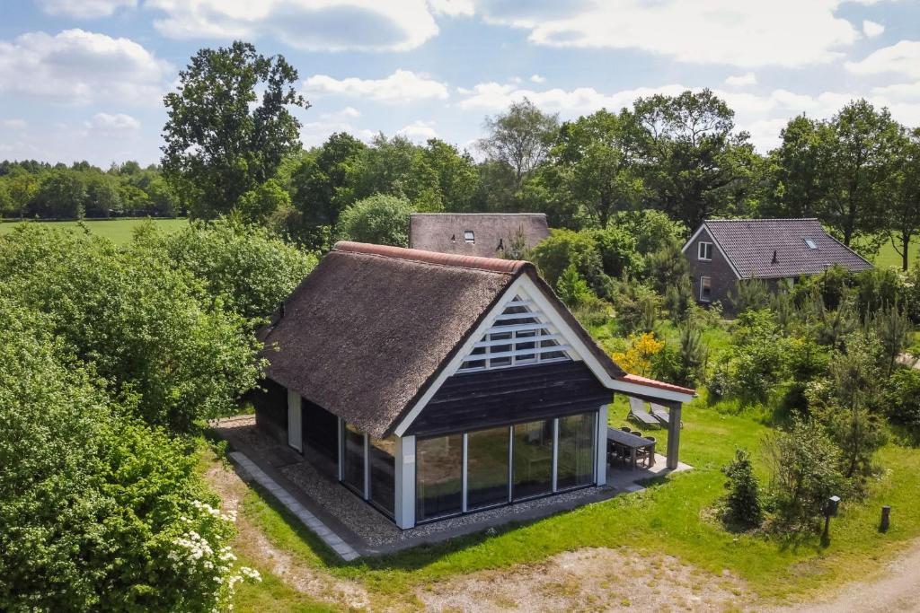 an overhead view of a small house with a grass roof at Buitengoed Rheelanden in Ansen