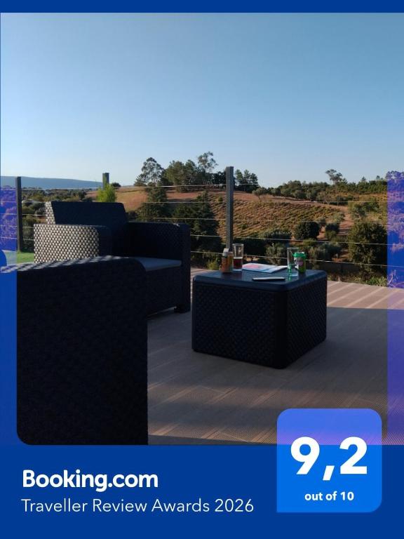 avisor picture of a patio with a couch and a table at AL Recanto do Sol in Torres Novas